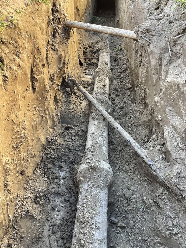 Buried water line exposed in a trench